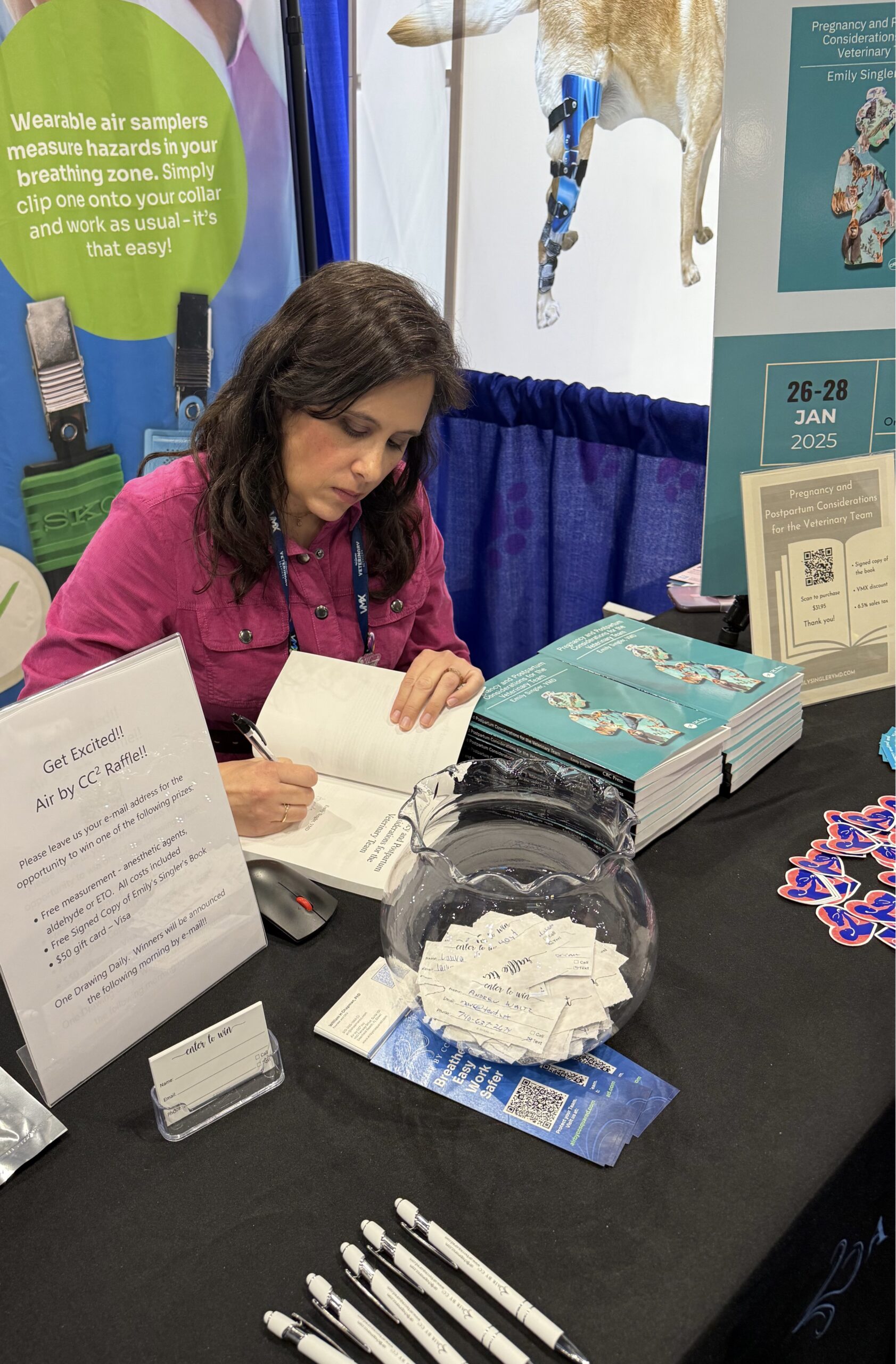 Emily signing books